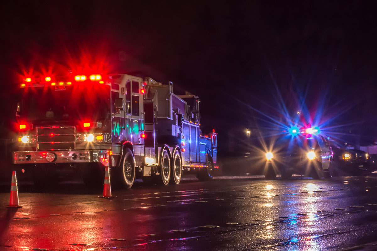 First Responders - firefighters and police officers - on a wet night