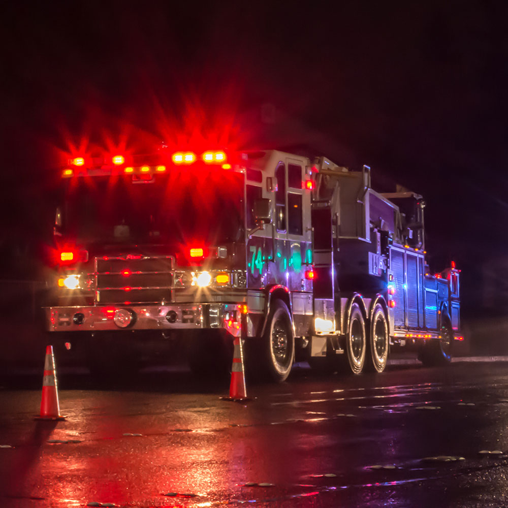 First Responders - firefighters and police officers - on a wet night
